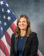 Portrait of Sara Backhaus with American flag in background