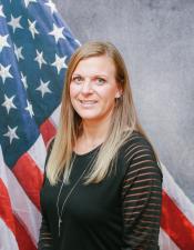 Portrait of Sara Backhaus with American flag in background