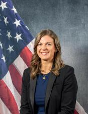 Portrait of Sara Backhaus with American flag in background