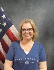 Portrait of Wendy Brandt with American flag in background