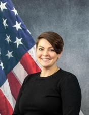 Portrait of Elizabeth Olson with American flag in background