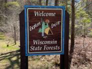 A Welcome to Wisconsin State Forests sign