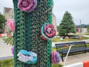Yarn art on lamp post.