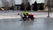 A small tractor acting as a "Zamboni" at the Washington Park Ice Rink
