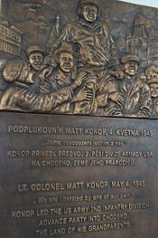A bronze plaque rendering of the Lt. Col. Konop photo along with a description below in English and Czech