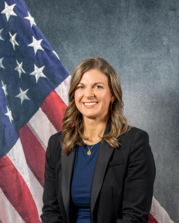 Portrait of Sara Backhaus with American flag in background