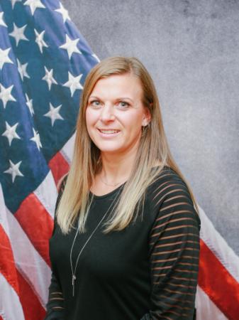 Portrait of Sara Backhaus with American flag in background