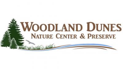 Woodland Dunes logo with evergreen trees, large bird and wetlands.
