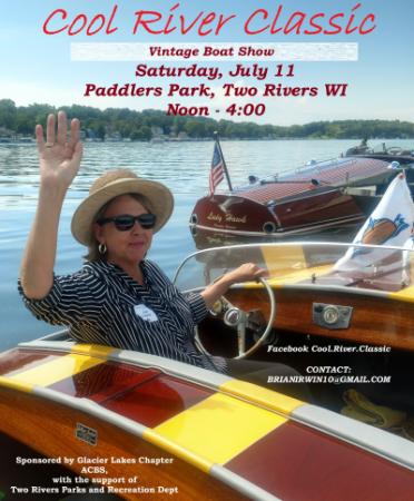 Woman in hat behind the wheel of a boat and looking back to wave at the camera.