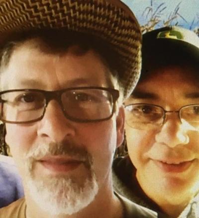Two men in hats and glasses.