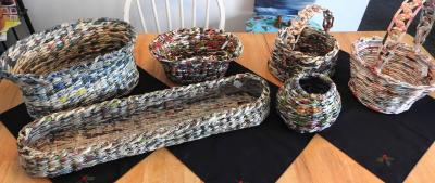 Several baskets made with rolled newspaper.
