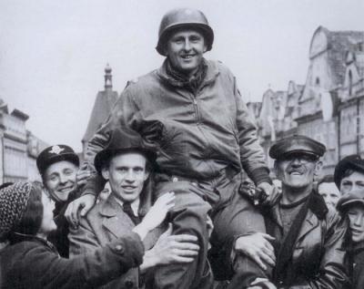 Lt. Col. Konop hoisted upon the shoulders of Czech villagers.