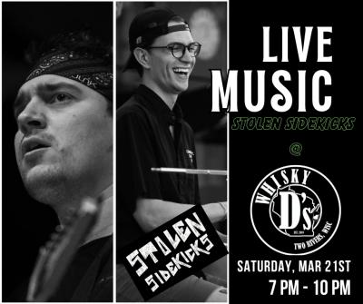 Two men singing onstage.