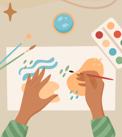 A pair of hands painting.