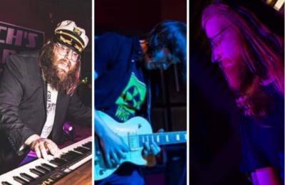 Three men performing onstage.