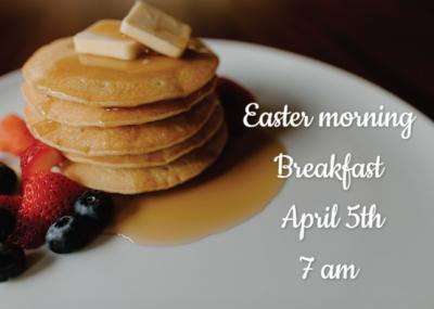 A stack of buttery, syrupy pancakes on a white plate.