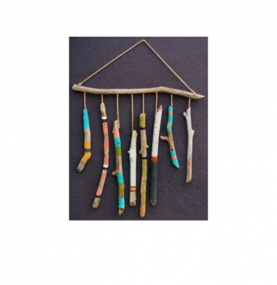 A wallhanging made of small pieces of driftwood.