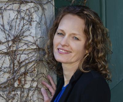 Smiling woman outdoors.