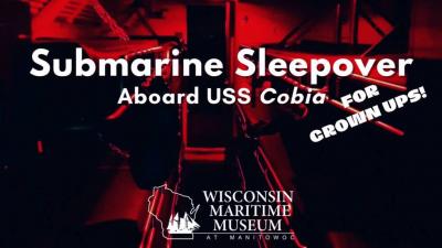 A red-hued image of the interior of the USS Cobia.