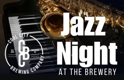 A saxophone laying upon piano keys.