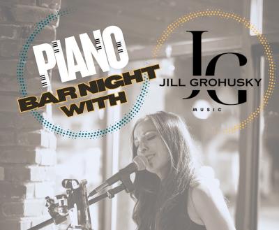 Woman playing piano and singing into microphone.