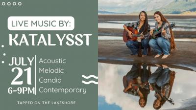 Two young women with long hair and flannel shirts, holding guitars and squatting next to pool of water reflecting their image.