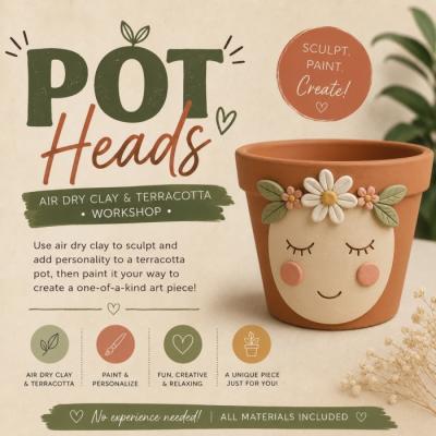 Terracotta pot with cute face painted on it.