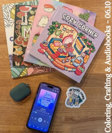 Coloring books, a phone and earbuds.