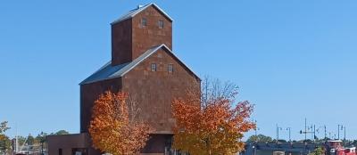A historic granary with nearby boats.