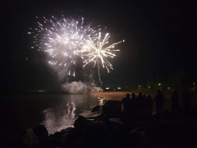 Fireworks exploding over Lake Michigan.