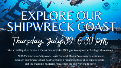A photo of a shipwreck lying upon the floor of Lake Michigan with blue waters above and fish swimming about.