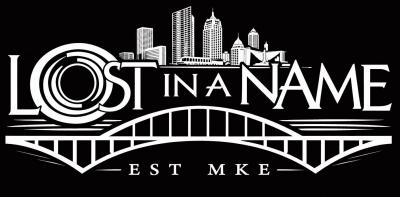 White line image of the Milwaukee skyline and bridge on black background.