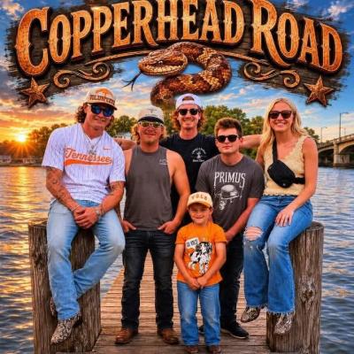 Band members (four men, one woman and a little boy) with the sun setting over a lake in the background & image of copperhead.