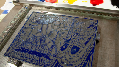 Print block with image of mid-century carnival scene