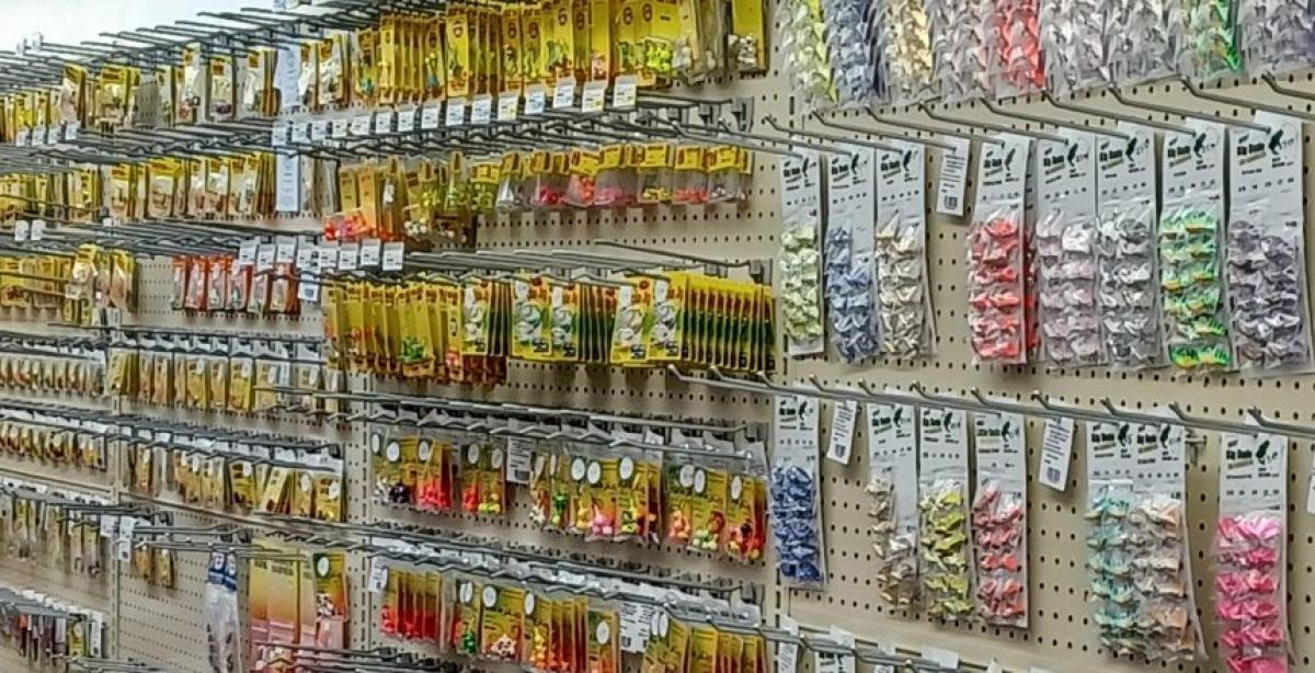 A pegboard wall filled with fishing supplies