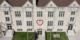 Community House in Two Rivers with big red heart mounted on the front.