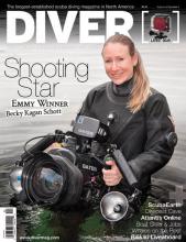 Diver magazine cover depicting Becky Kagan Scott wearing dive suit and holding camera.