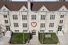 Community House in Two Rivers with big red heart mounted on the front.