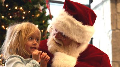 Santa talks with a little girl