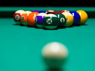 Pool balls racked to play.