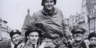 Lt. Col. Matt Konop held aloft in celebration by citizens of Domazlice, Czech Republic.