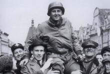 Lt. Col. Matt Konop held aloft in celebration by citizens of Domazlice, Czech Republic.